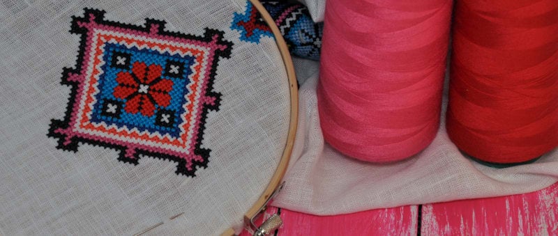 Embroidery hoop and red thread