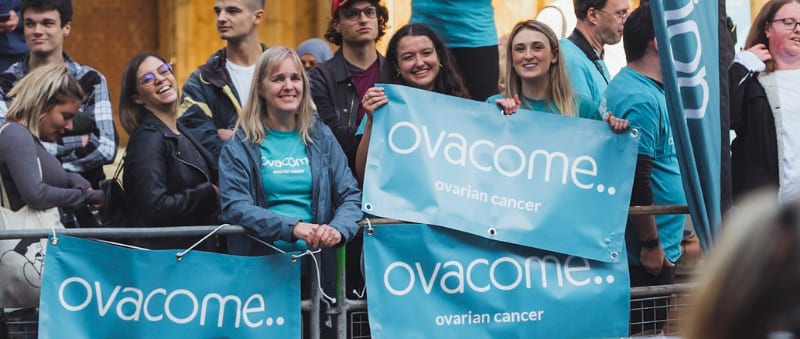 Photo of people holding Ovacome banners