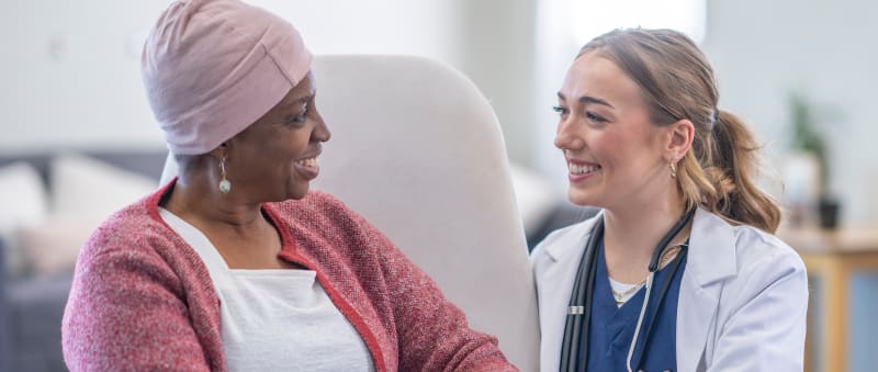 Smiling woman speaking to her doctor
